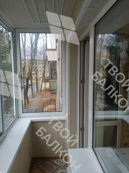 Отделка балкона под ключ с холодным остеклением и выносом остекления