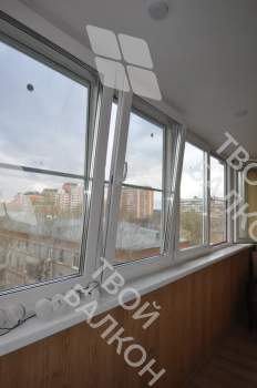 Остекление лоджии окнами с мультифункциональным стеклопакетом и отделка