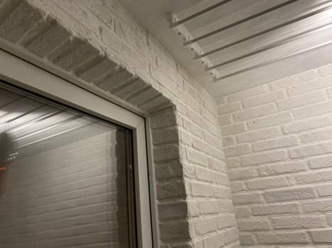 Отделка камнем с утеплением балкона Сапожок